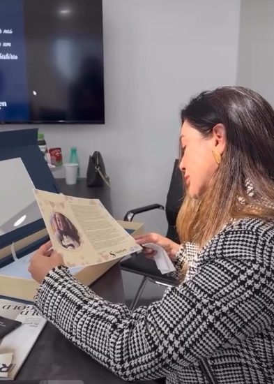 A StarGen client reading the letter written about her story
